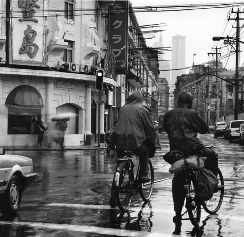 bicycles under the rain in hutong areas of Shangai China, Photo Paul Maurer