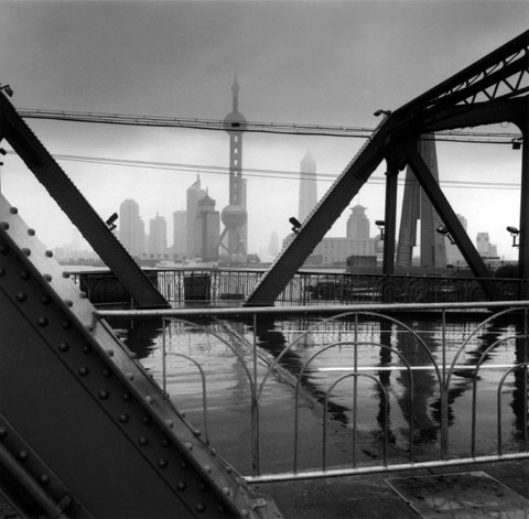Industrial areas in Shangai harbour view towards Pudong's TV Tower photo Paul Maurer